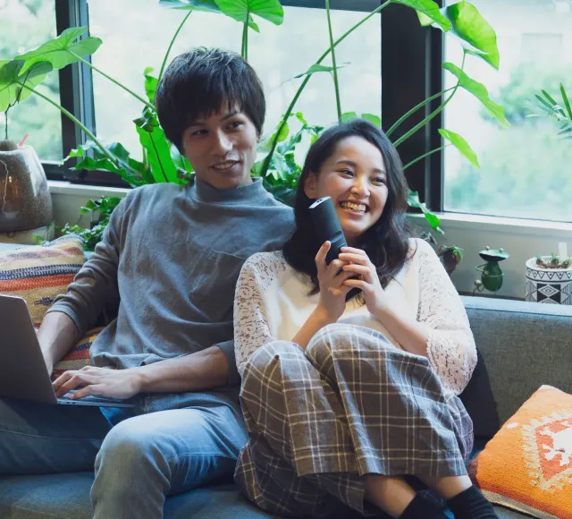Couple watching TV - APAC hero image