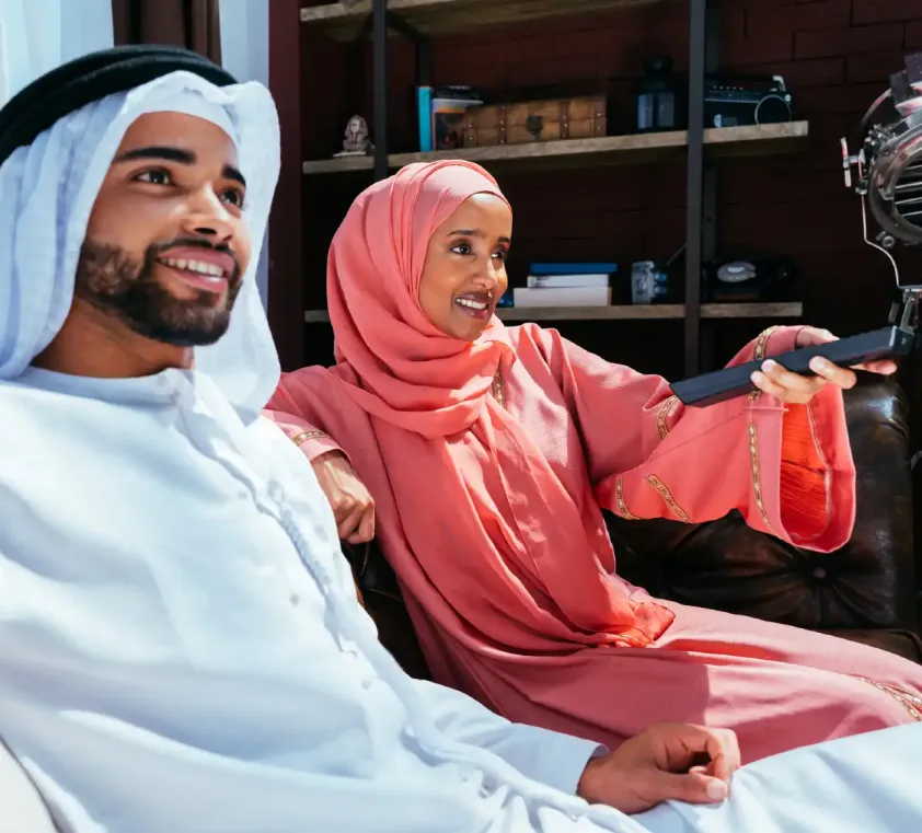 Image of couple in the Middle East watching tv 