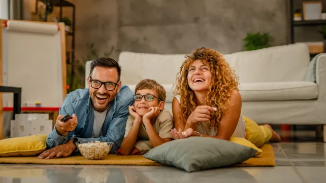 IMAGE_Press_Family-watching-TV-while-eating-popcorn-GettyImages-2157953375_080824.webp