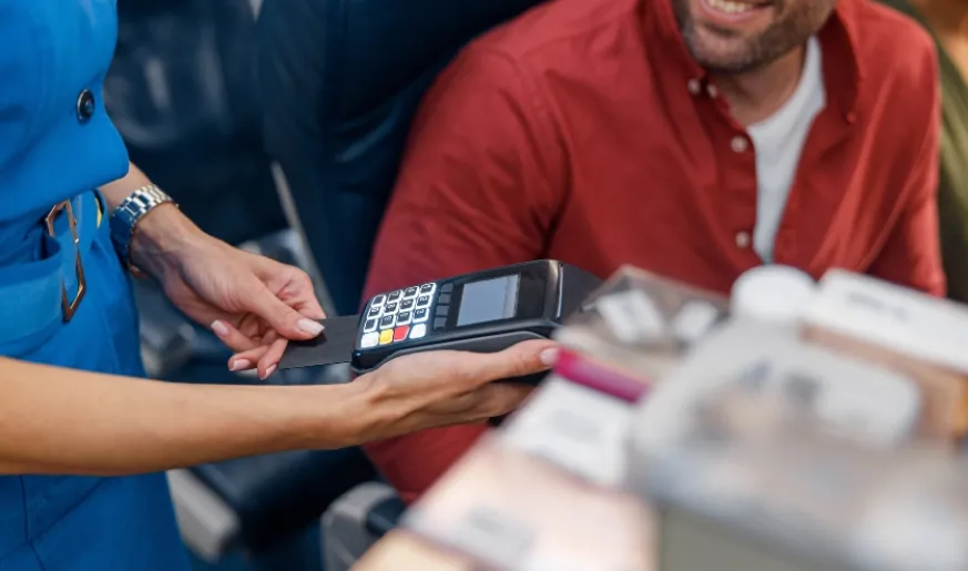 Commercial Aviation Connectivity Commercial aviation passenger makes payment.