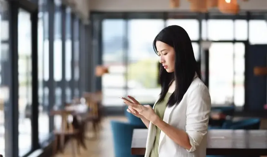 Photo of a woman using her mobile