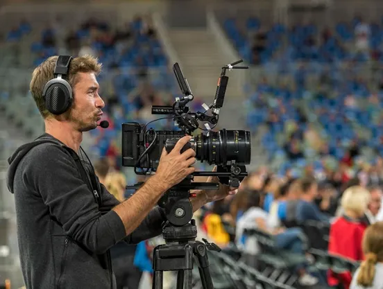 Cameraman filming sports event