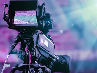 Photo of a camera filming an event
