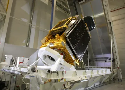 EUTELSAT 70B satellite being loaded into the container to make its way to Long Beach, California