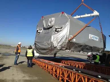 EUTELSAT 3B satellite being loaded onto the airport runway to make its way to California