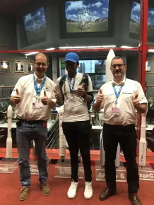 Tanaka Chonyera, DStv Eutelsat star awards essay winner 2018, visiting the Guiana Space Center with Emmanuel Franc (left) and Luca Chiecchio of Arianespace (right)