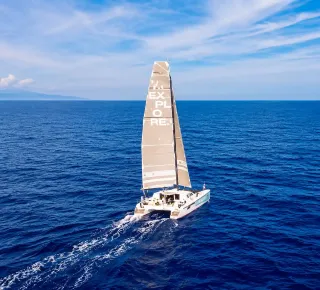 Sailboat cruising across the open ocean.