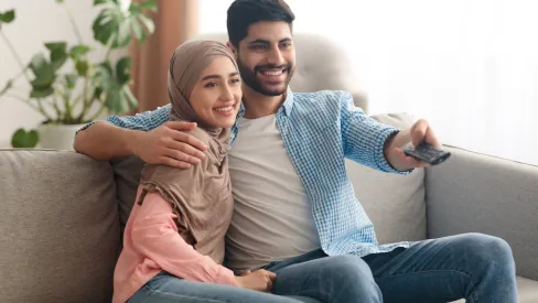 IMAGE_Press_Contented-middle-eastern-spouses-watching-movie_GettyImages-1386905865_221025.webp