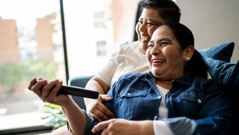IMAGE_Press_Lesbian-couple-watching-tv-at-home_GettyImages-2158408409_130925.webp